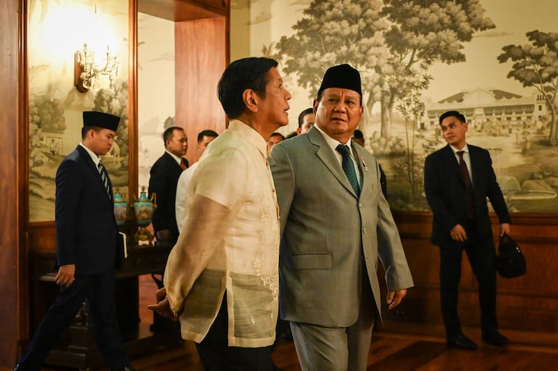 Philippines President Ferdinand Marcos Jr (L) walks with Indonesia�s President-elect Prabowo Subianto during a courtesy call at Malacanang Palace in Manila on September 20, 2024. (Photo by Jam Sta Rosa / POOL / AFP)