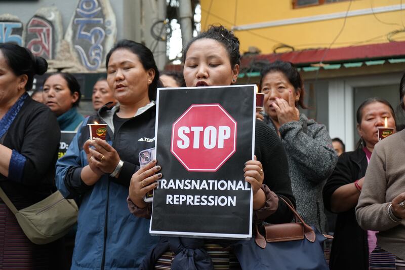 Devotees of revered Tibetan Buddhist monk Tulku Hungkar Dorjee take part in a candlelight vigil in Dharamsala, India, April 11, 2025.