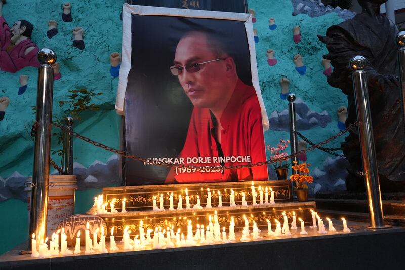 Devotees of revered Tibetan Buddhist monk Tulku Hungkar Dorjee take part in a candlelight vigil in Dharamsala, India, April 11, 2025.