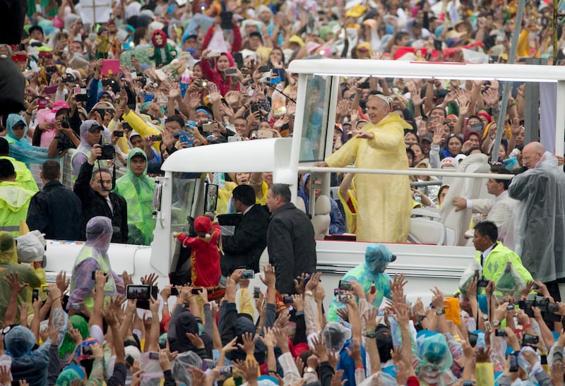 Pope Francis arrives for a Mass at Rizal Park, in Manila, Philippines, Jan. 18, 2015.